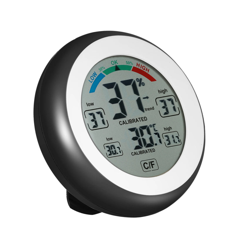 Termómetro e higrómetro digital (°C/°F) con visualización de valores máximos/mínimos y tendencia; mini medidor de temperatura y humedad.